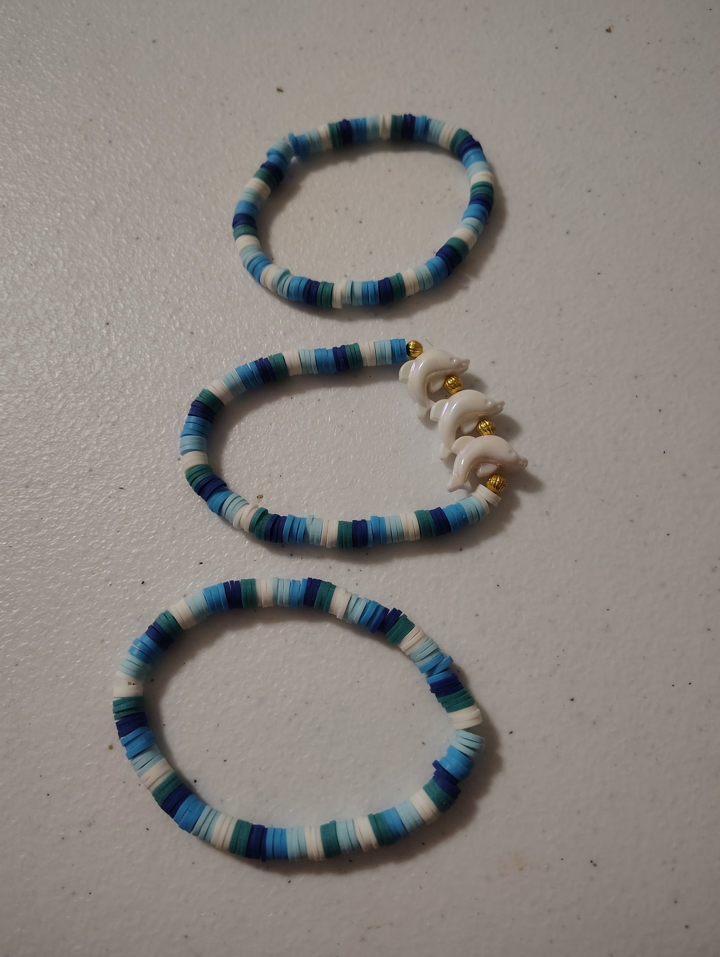 Beautiful set of Seed Bead Bracelets with White Dolphins